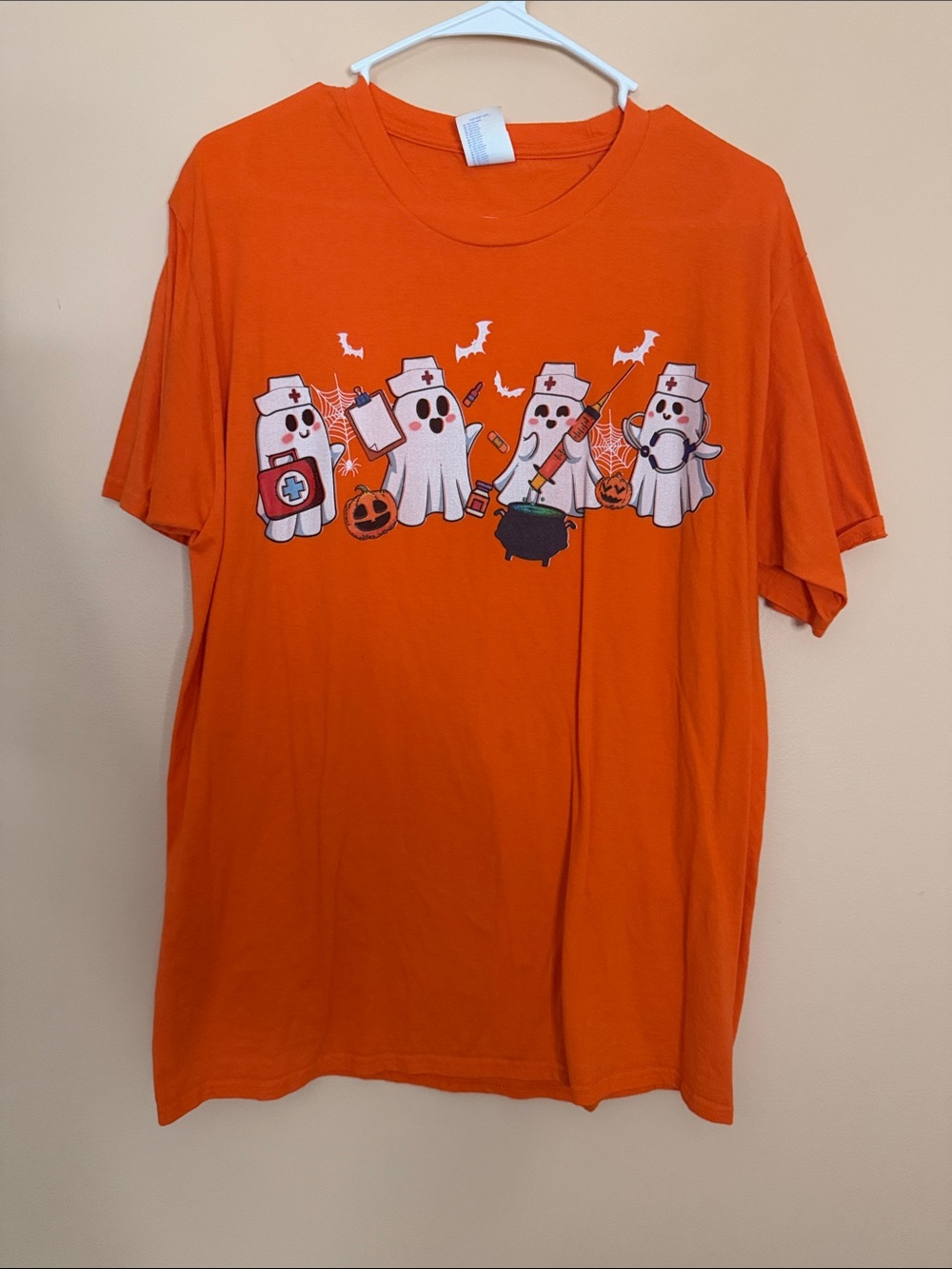 Orange Halloween Nurse Ghost Graphic Tee - Women's Short Sleeve